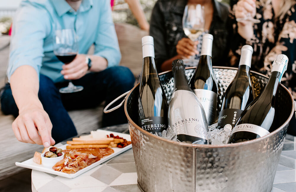 Bottles of Sterling Chardonnay, Malvasia Bianca, Prosecco, & Sparkling Blanc de Blanc in Ice Bucket at Party