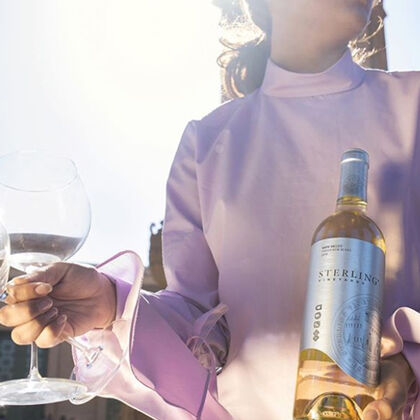 Woman enjoying Sterling Vineyards Sauvignon Blanc